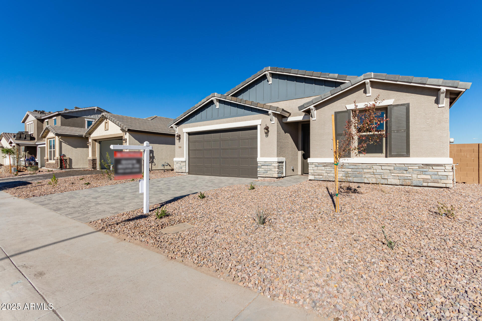 5008 West Roundhouse Road Laveen, AZ 85339 - Photo 31 of 36 a front view of a house with a yard
