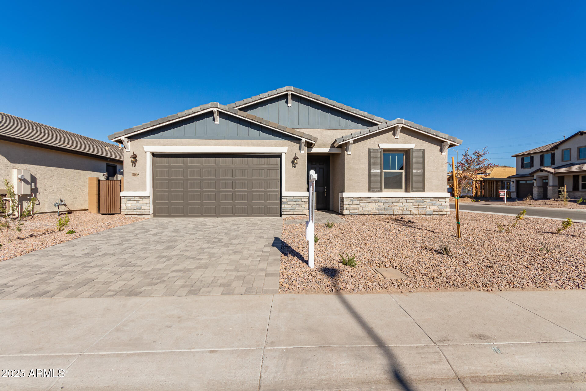 5008 West Roundhouse Road Laveen, AZ 85339 - Photo 35 of 36 a front view of a house with a yard