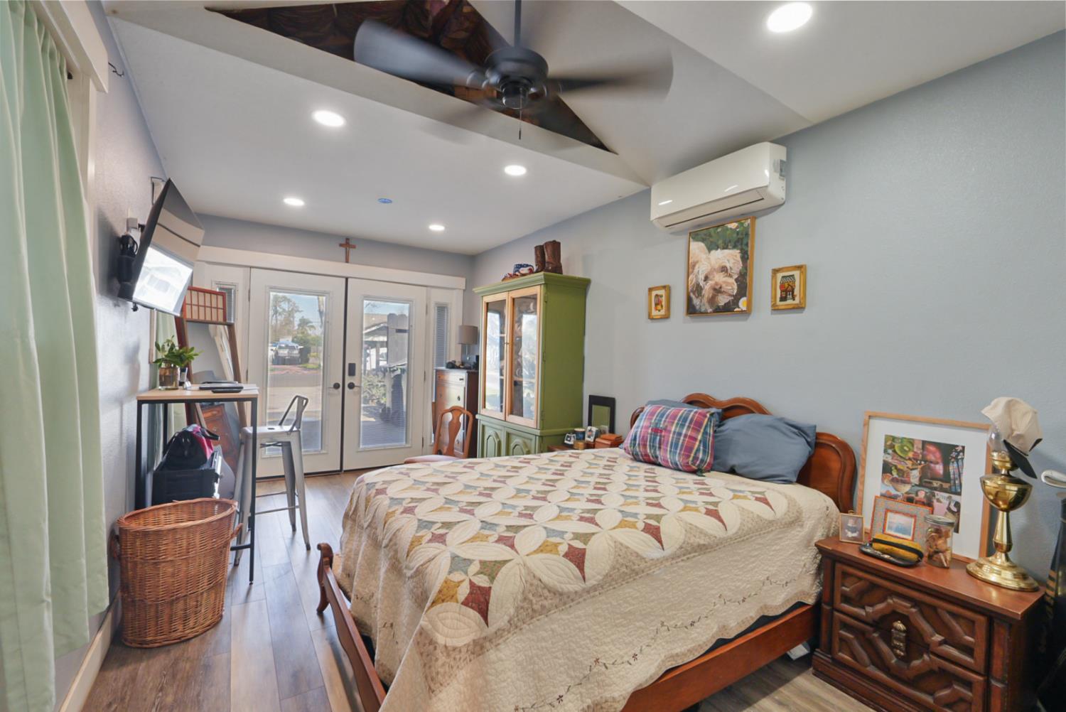 526 Flower Street Turlock, CA 95380 - Photo 11 of 28 a bedroom with a bed and wooden floor