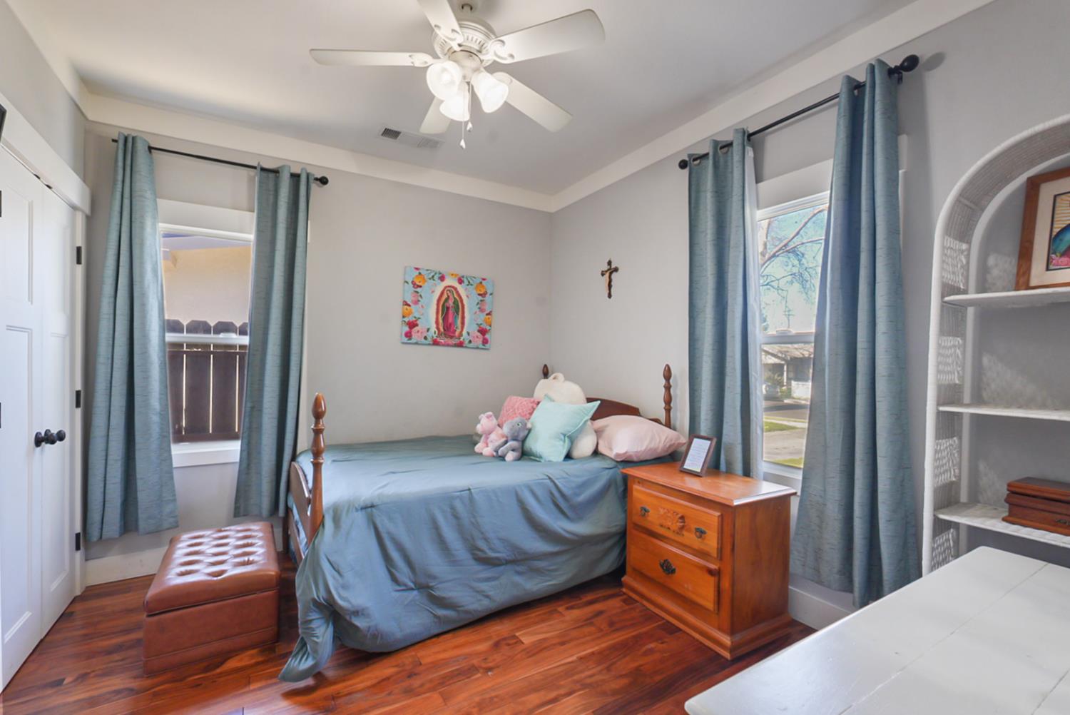 526 Flower Street Turlock, CA 95380 - Photo 19 of 28 a bedroom with furniture and a window