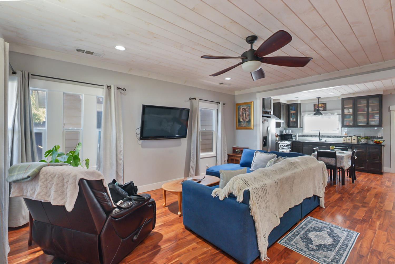 526 Flower Street Turlock, CA 95380 - Photo 4 of 28 a living room with furniture and a flat screen tv
