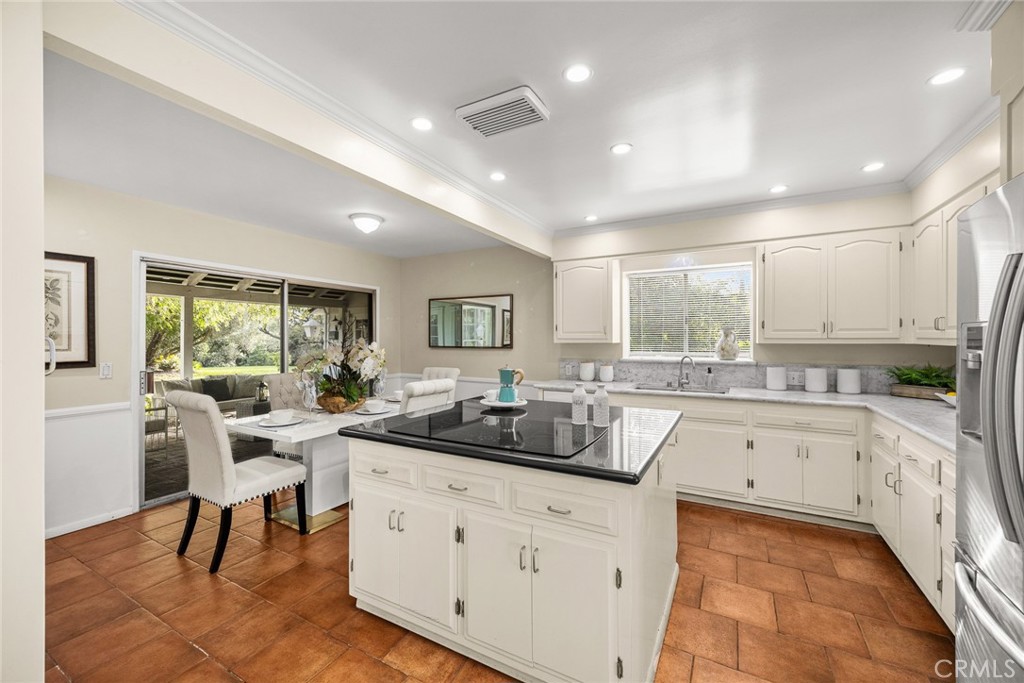 1110 Fallen Leaf Road Arcadia, CA 91006 - Photo 12 of 38 a kitchen with white cabinets and sink