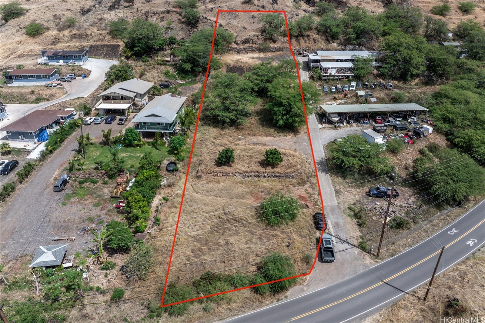 86-174 Mailiilii Road Waianae, HI 96792 - Photo 3 of 4 an aerial view of a house with a yard and garden