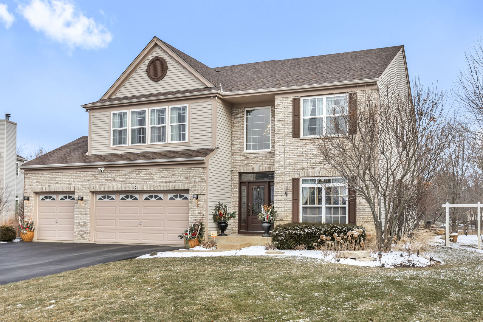 2720 Wisteria Way Port Barrington, IL 60010 - Photo 1 of 38 a front view of a house with a yard