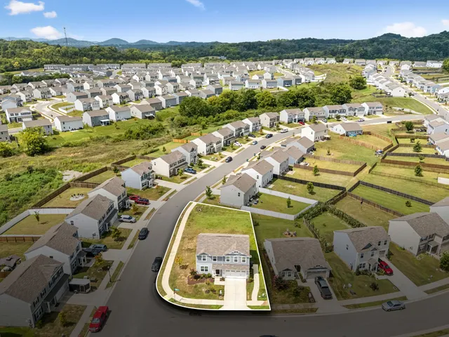 an aerial view of residential house with outdoor space and river