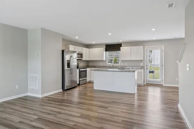a view of kitchen with wooden floor