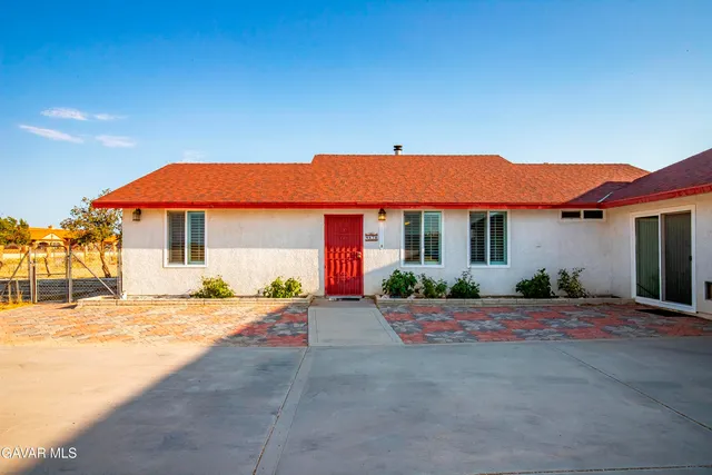 a house with trees in front of it