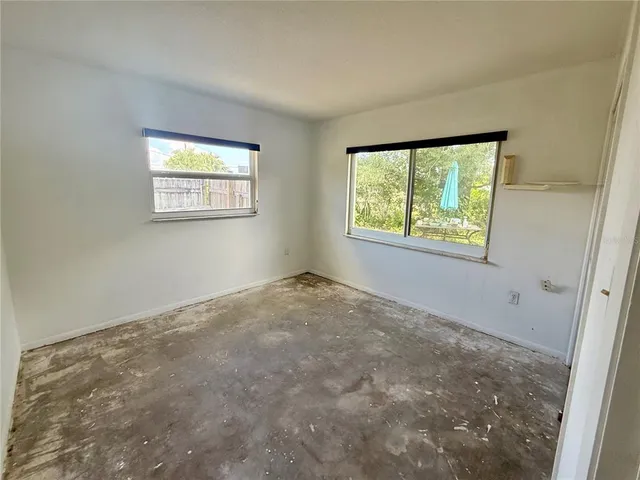 an empty room with windows