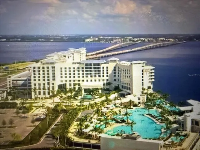 an aerial view of a house with a ocean view