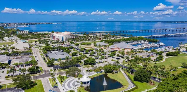 a view of a balcony with dining table and chairs with wooden floor