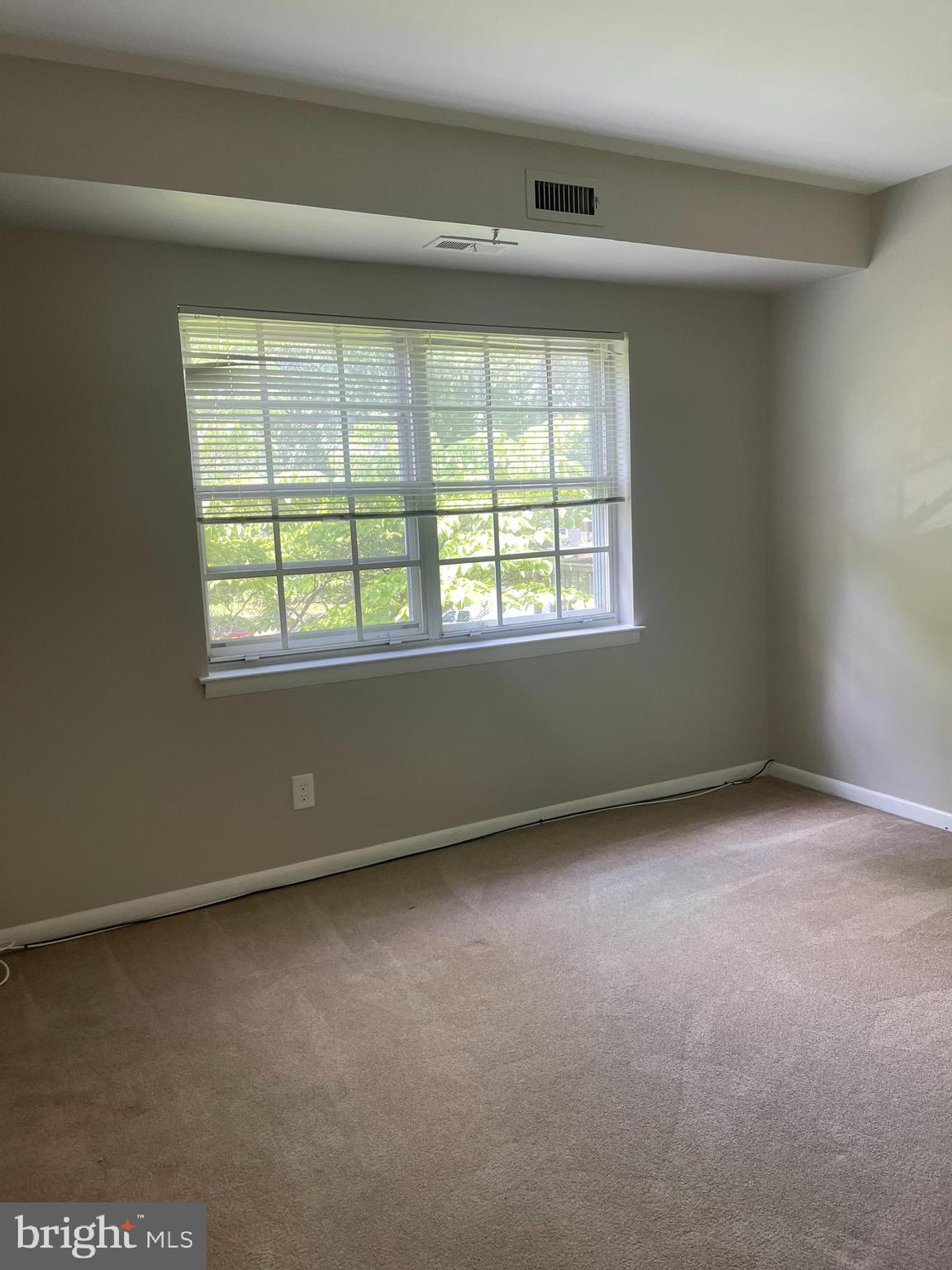 247 Old Forge Crossing, Unit 247 Devon, PA 19333 - Photo 5 of 10 an empty room with a window
