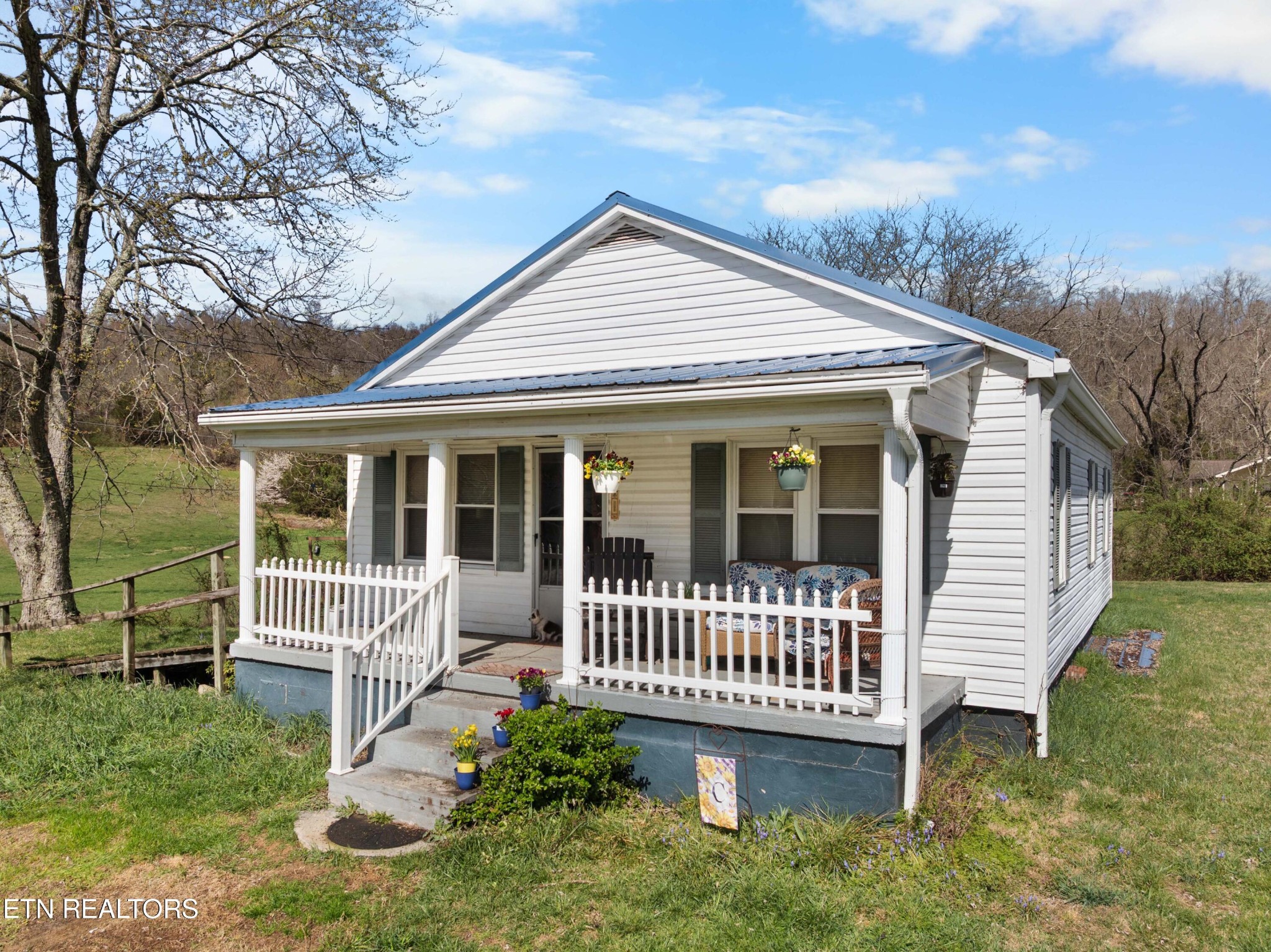 385 Hubbs Grove Road Maynardville, TN 37807 - Photo 2 of 33 a view of a house with a small yard and deck