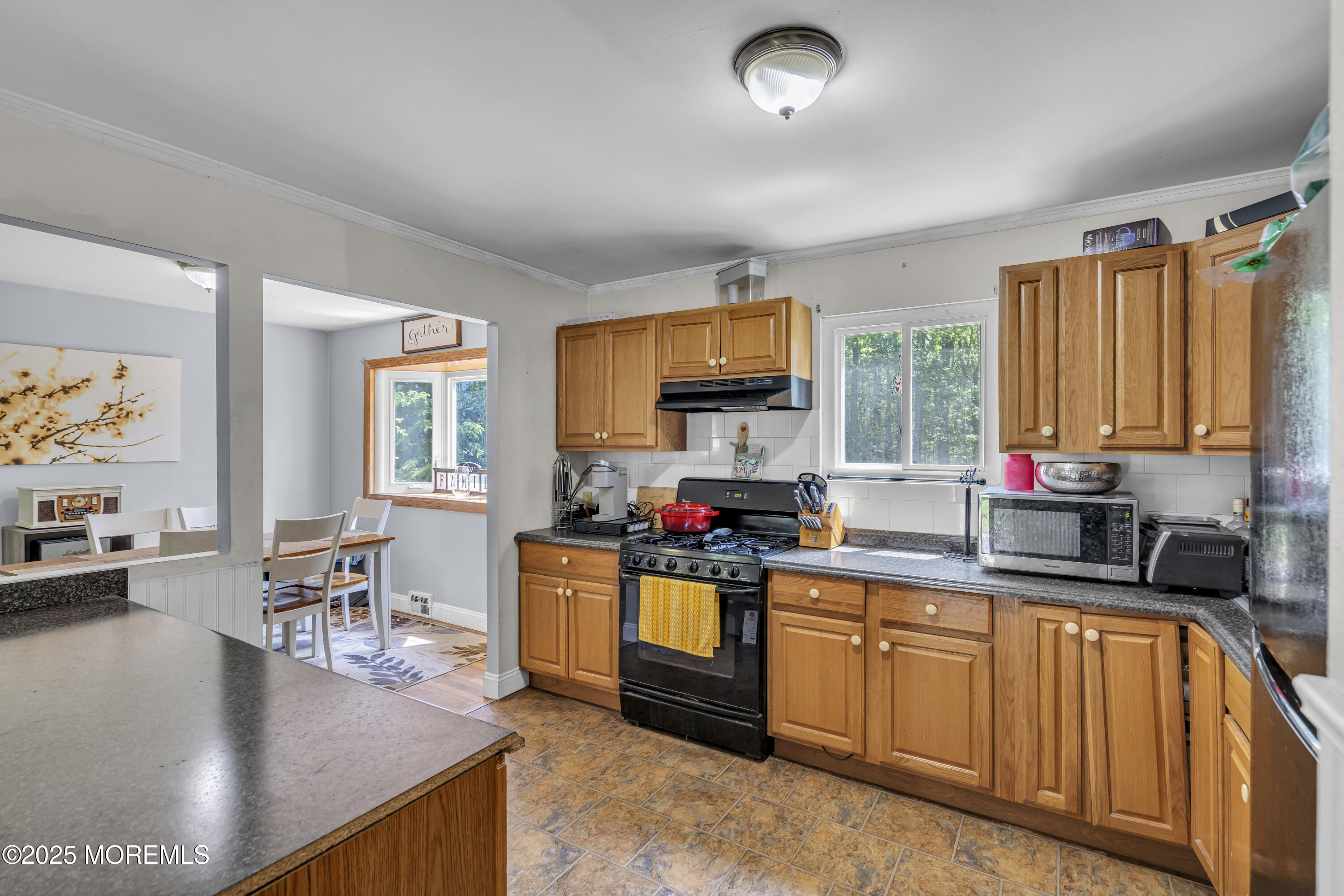 47 Beam Avenue Jackson, NJ 08527 - Photo 12 of 30 a kitchen with stainless steel appliances granite countertop a stove top oven a sink dishwasher and cabinets with wooden floor