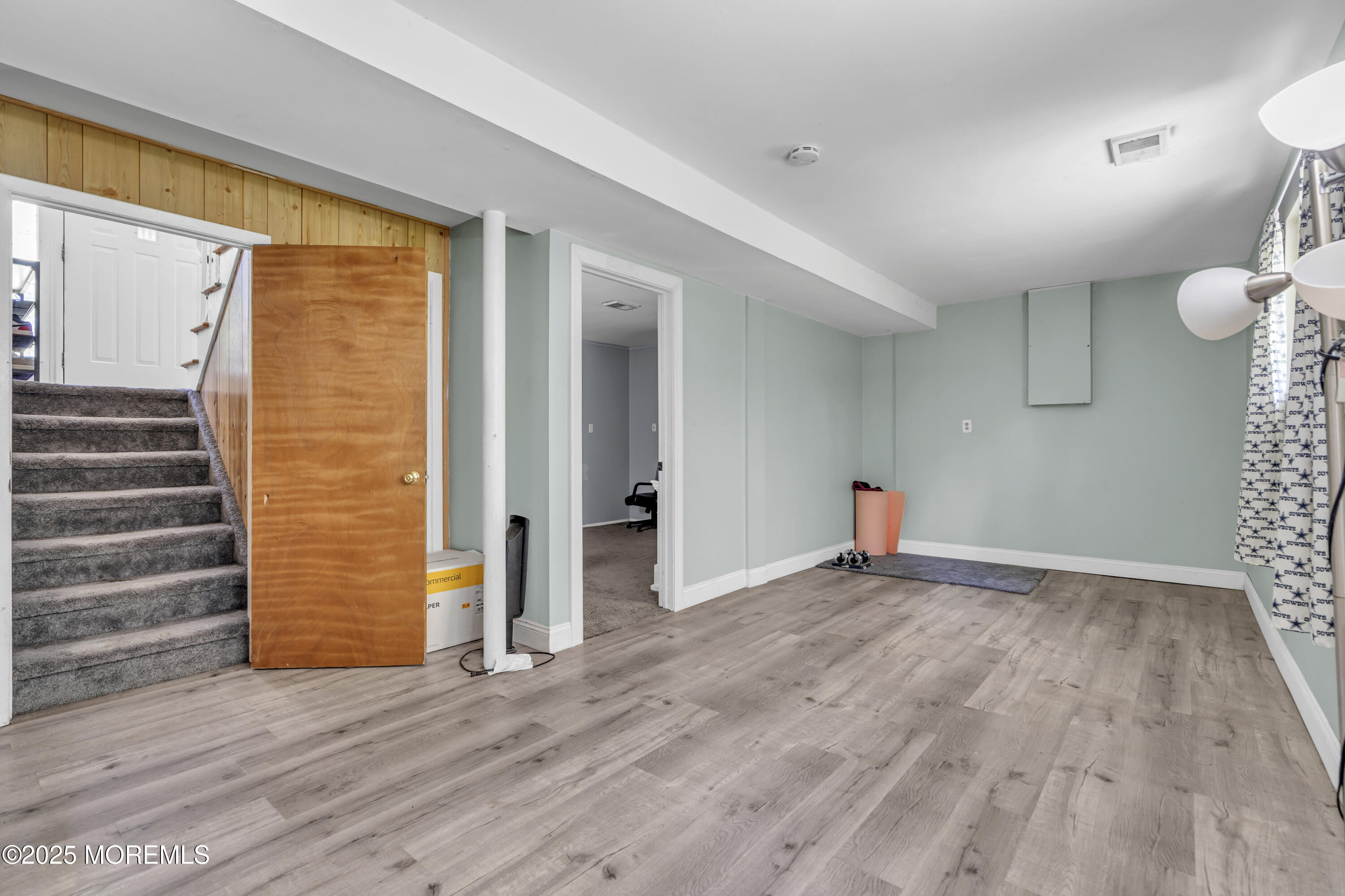 47 Beam Avenue Jackson, NJ 08527 - Photo 20 of 30 a view of an empty room with wooden floor and a window