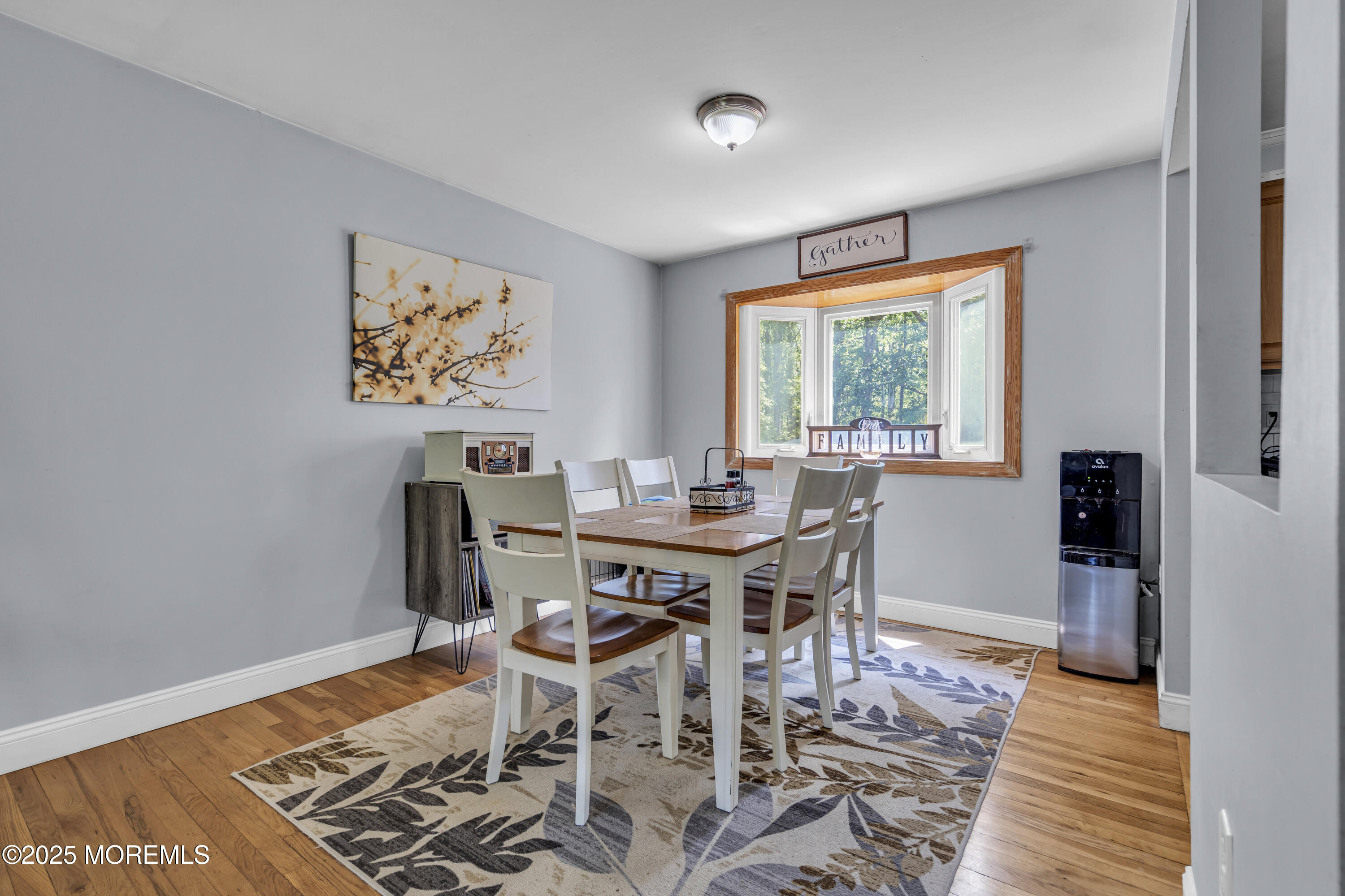 47 Beam Avenue Jackson, NJ 08527 - Photo 9 of 30 a view of a dining room with furniture window and wooden floor