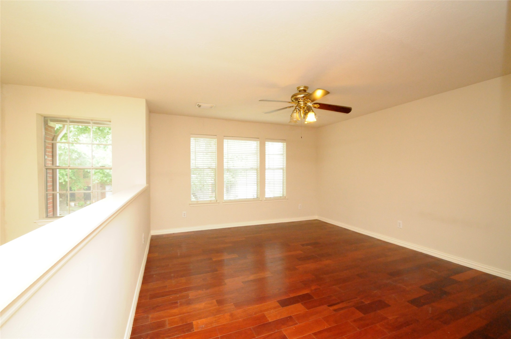 16127 Eaglewood Spring Court Houston, TX 77083 - Photo 27 of 31 a view of an empty room and a window