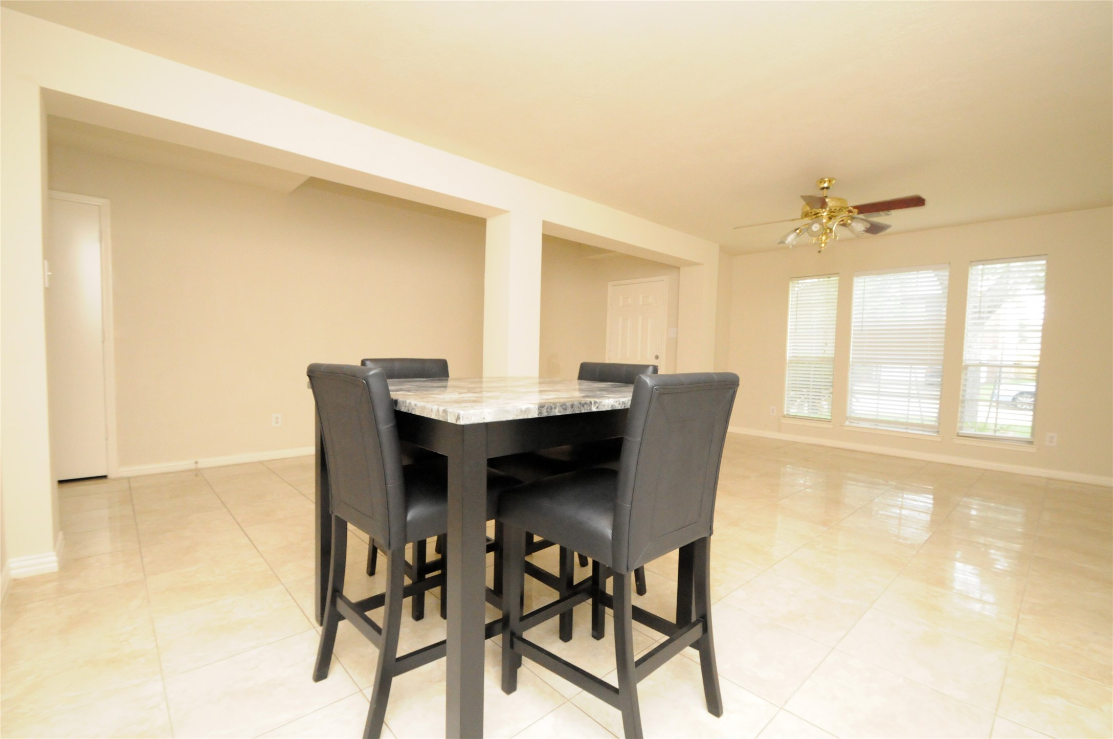 16127 Eaglewood Spring Court Houston, TX 77083 - Photo 8 of 31 a dining room with furniture and window