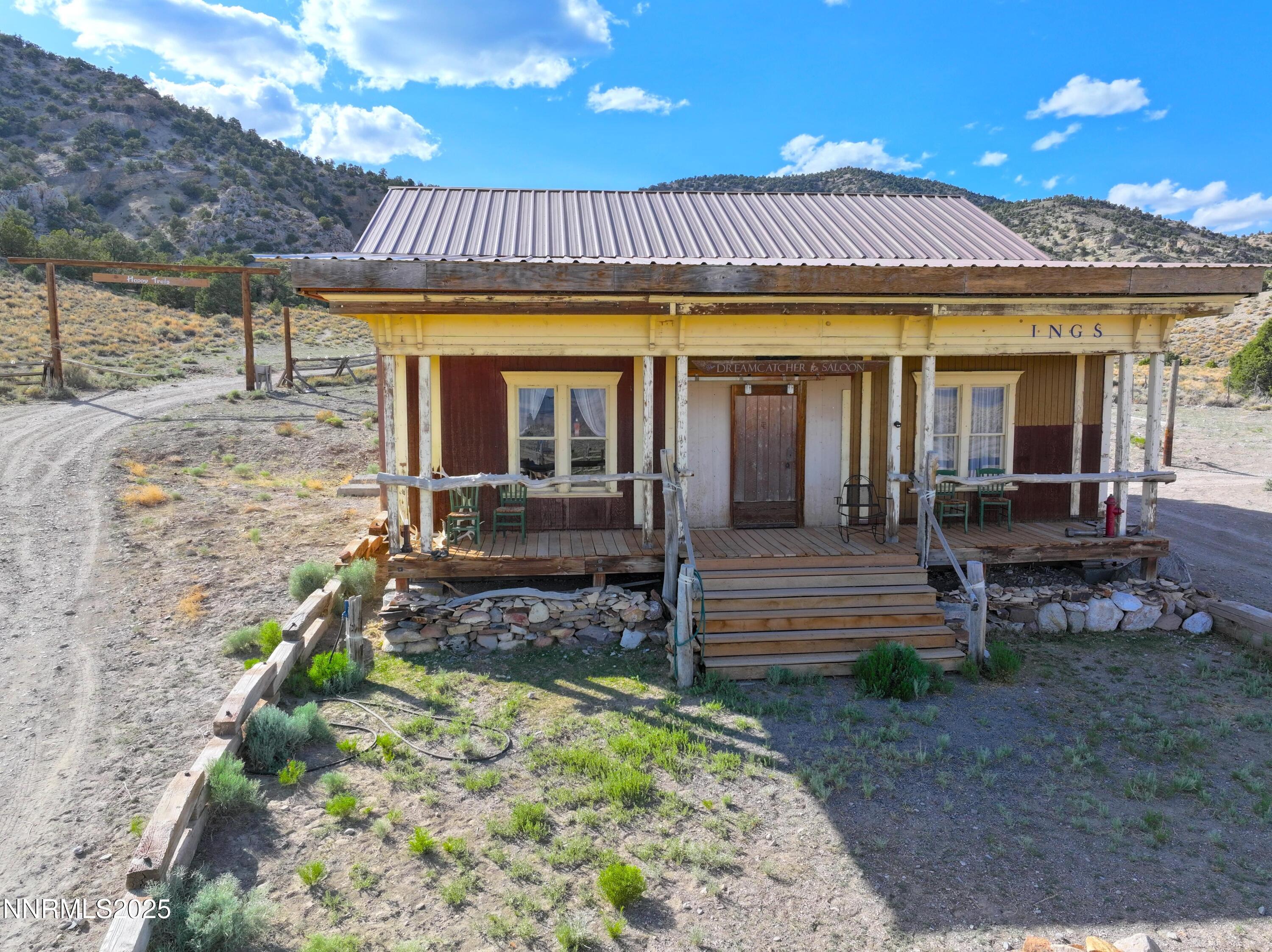 3350 Ikes Cyn Road Round Mountain, NV 89045 - Photo 13 of 38 a view of a house with a patio