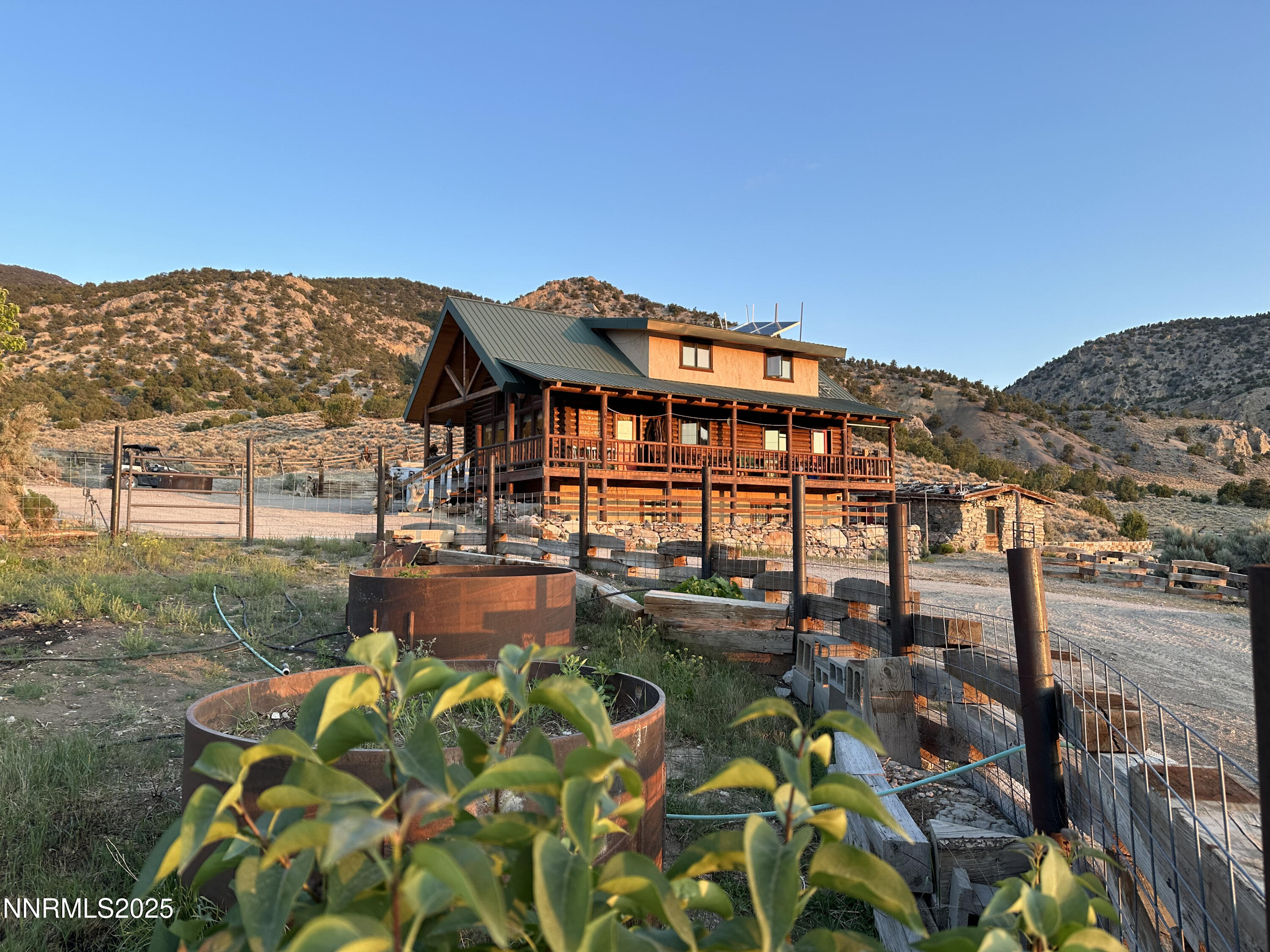 3350 Ikes Cyn Road Round Mountain, NV 89045 - Photo 19 of 38 a backyard of a house with yard table and chairs