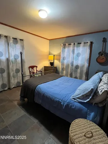 a bedroom with furniture window and a wooden floor