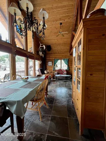 a view of a wooden house with a yard