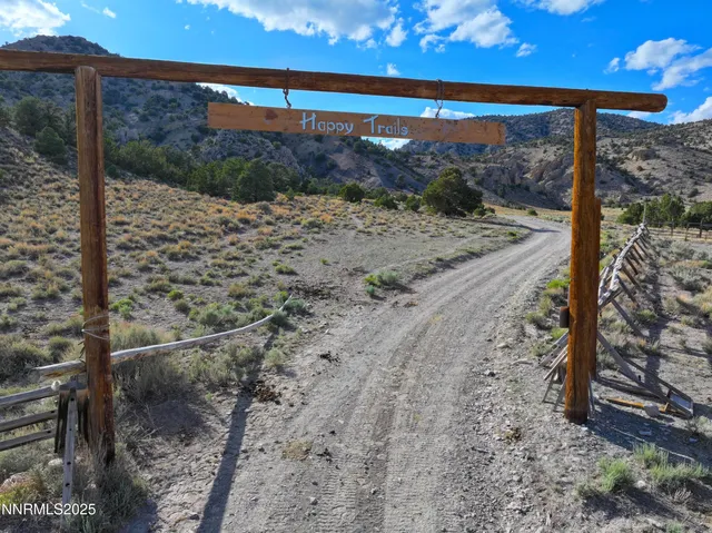 an aerial view of residential houses with outdoor space and river
