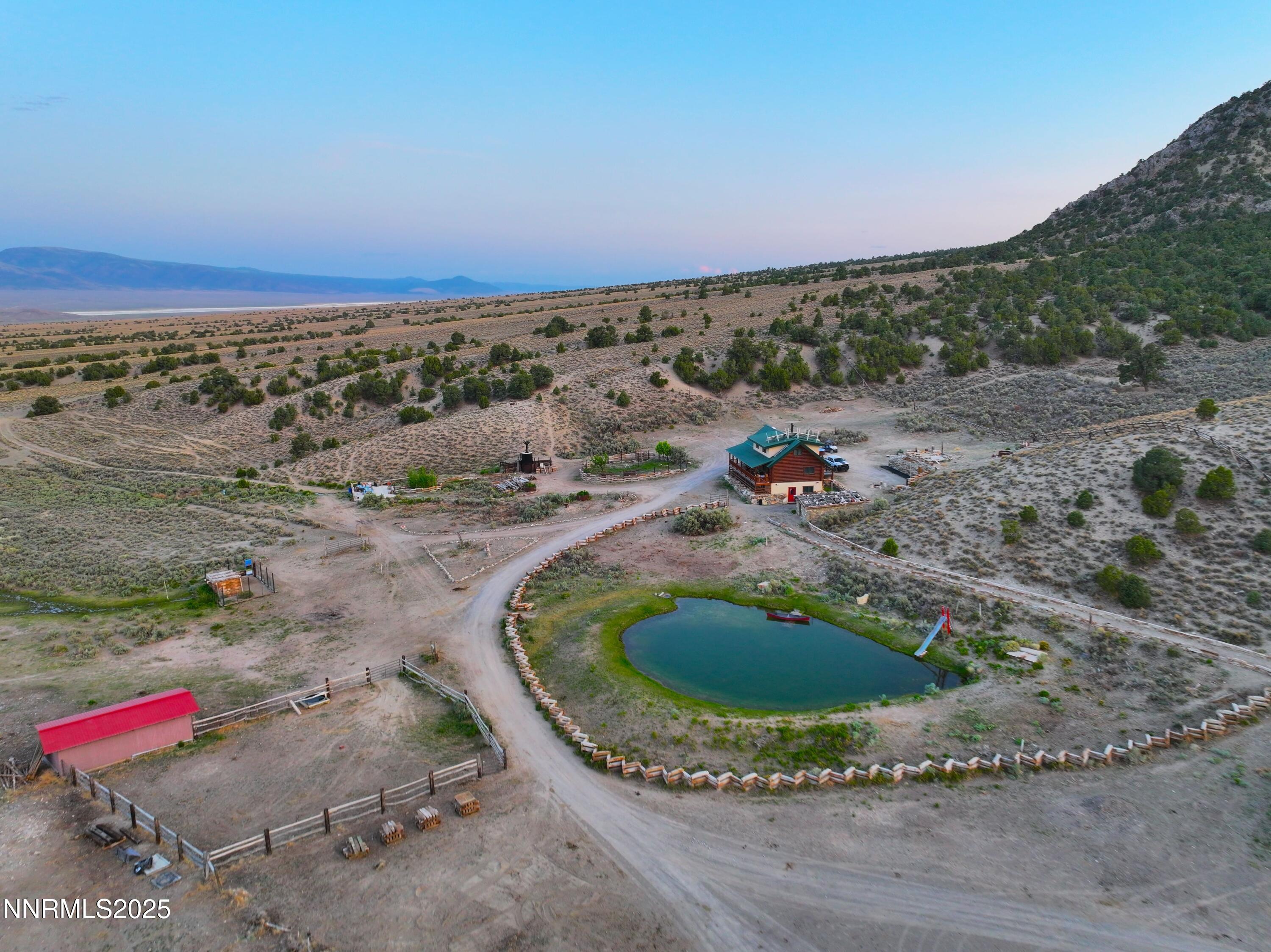 3350 Ikes Cyn Road Round Mountain, NV 89045 - Photo 4 of 38 a view of a wooden floor with a yard
