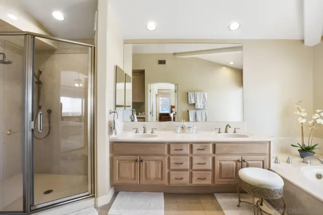 a view of swimming pool with outdoor seating and plants