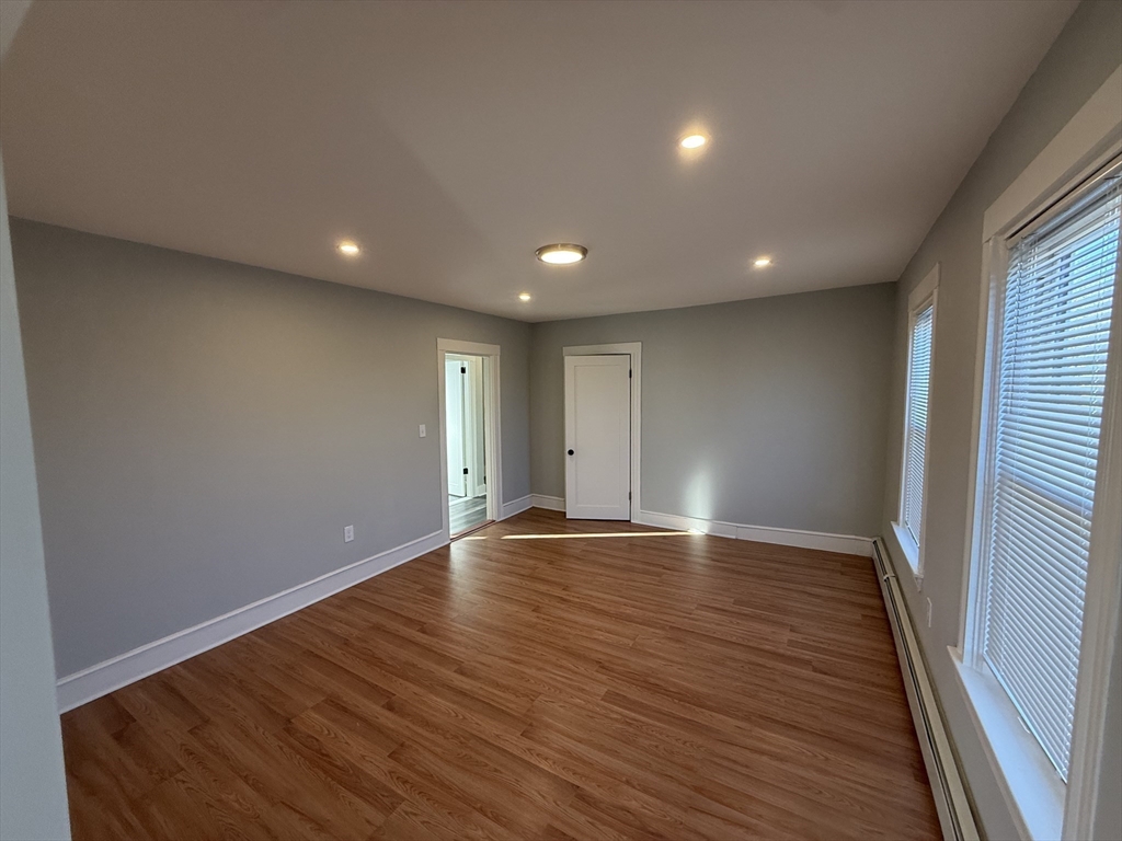 1922 Columbus Avenue, Unit 3 Boston, MA 02119 - Photo 5 of 22 a view of room with hardwood floor
