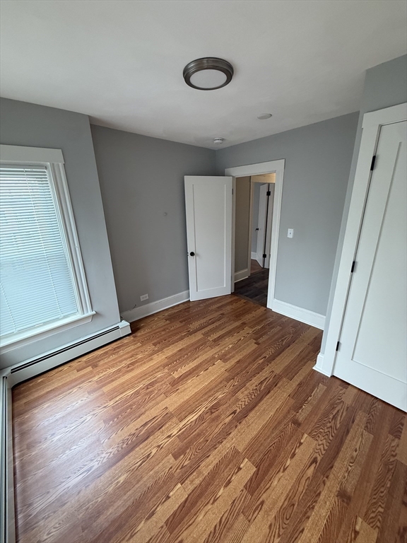 1922 Columbus Avenue, Unit 3 Boston, MA 02119 - Photo 10 of 22 a view of a room with wooden floor and closet