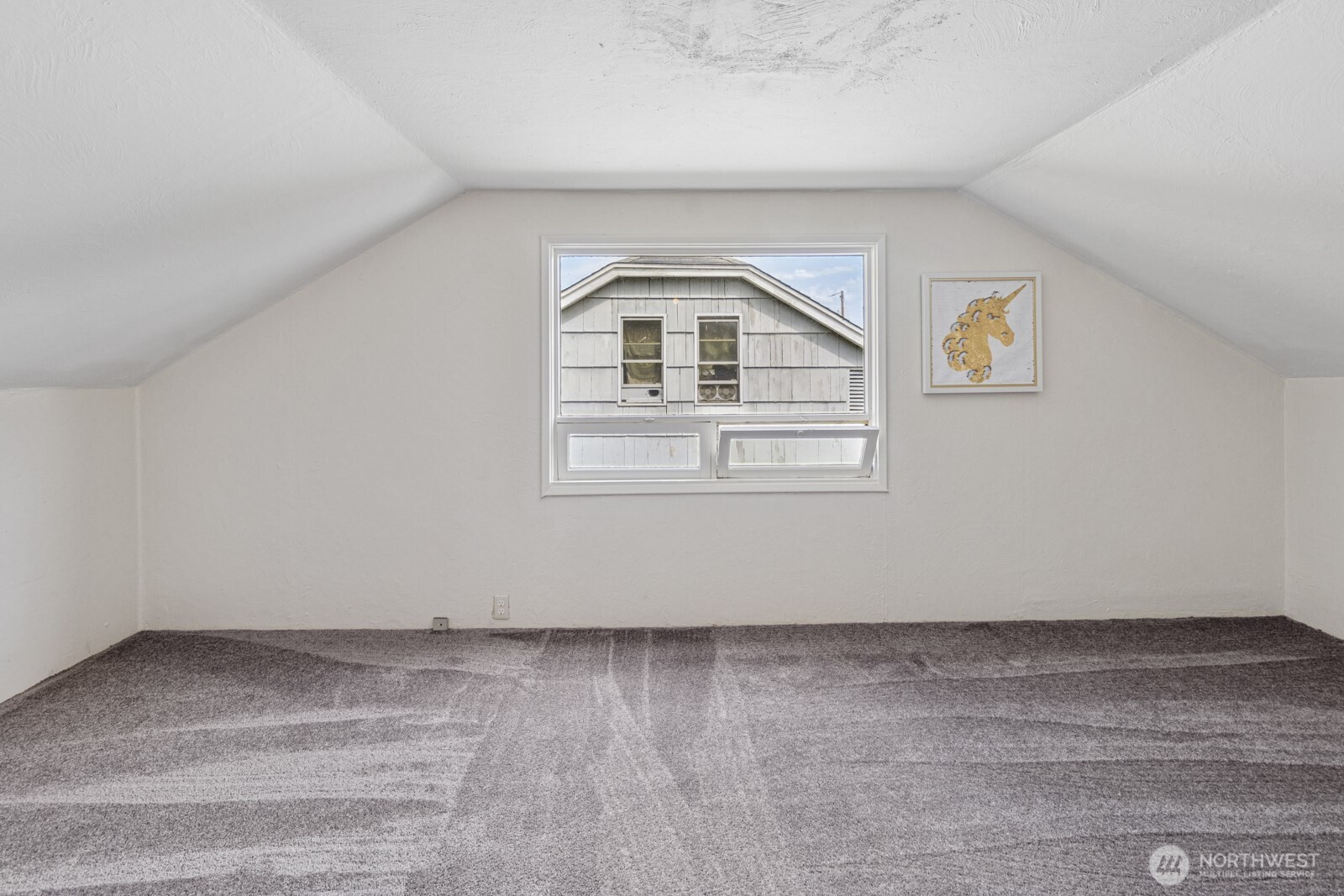 2640 Queets Avenue Hoquiam, WA 98550 - Photo 19 of 28 an empty room with wooden floor and white walls