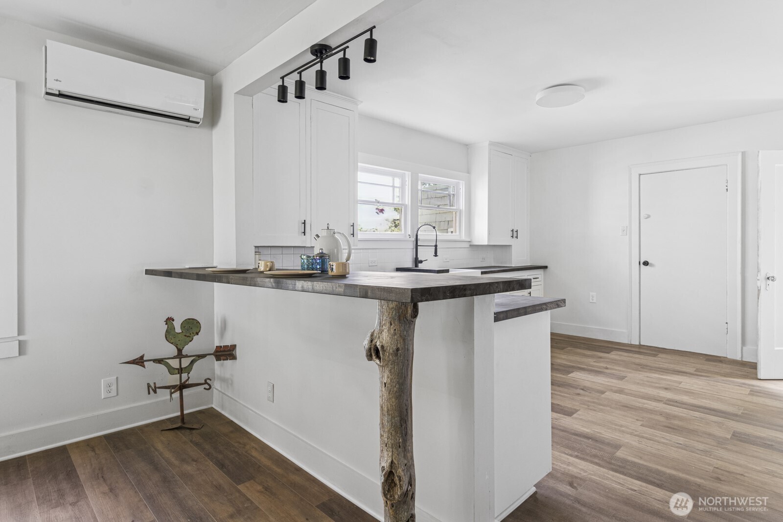2640 Queets Avenue Hoquiam, WA 98550 - Photo 4 of 28 a room with kitchen island a sink and wooden floor
