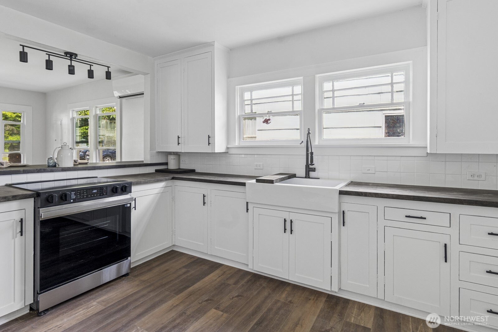 2640 Queets Avenue Hoquiam, WA 98550 - Photo 7 of 28 a kitchen with granite countertop white cabinets and a sink