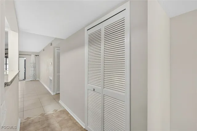 a view of a hallway with a white door