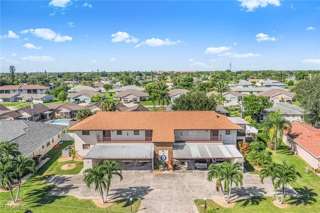 an aerial view of a house with a garden