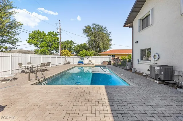 a view of a backyard with sitting area