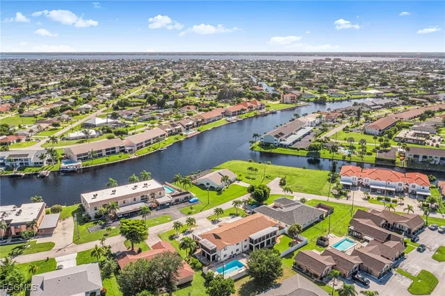 an aerial view of a houses with an outdoor space