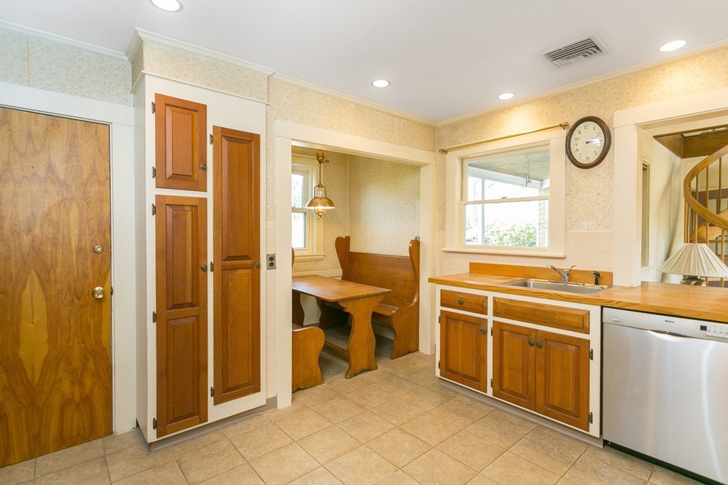 25 Rutledge Road Natick, MA 01760 - Photo 11 of 30 a kitchen with stainless steel appliances granite countertop a stove and a refrigerator