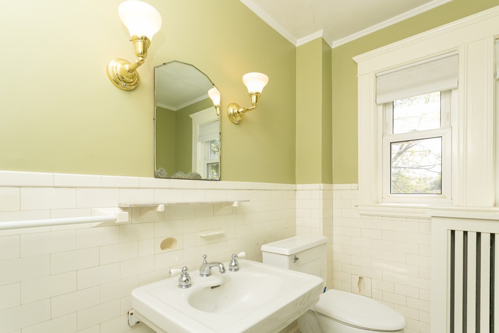 25 Rutledge Road Natick, MA 01760 - Photo 16 of 30 a bathroom with a sink a toilet and mirror