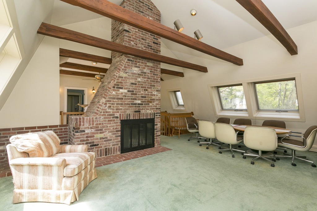 25 Rutledge Road Natick, MA 01760 - Photo 17 of 30 a living room with furniture a fireplace and a table