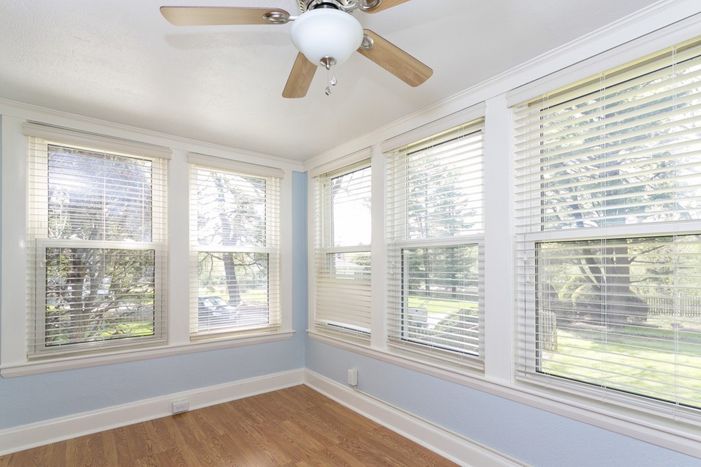 25 Rutledge Road Natick, MA 01760 - Photo 6 of 30 a view of an empty room with a window and a ceiling fan