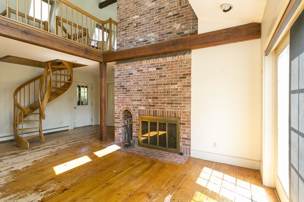 25 Rutledge Road Natick, MA 01760 - Photo 8 of 30 a view of an empty room and fire place