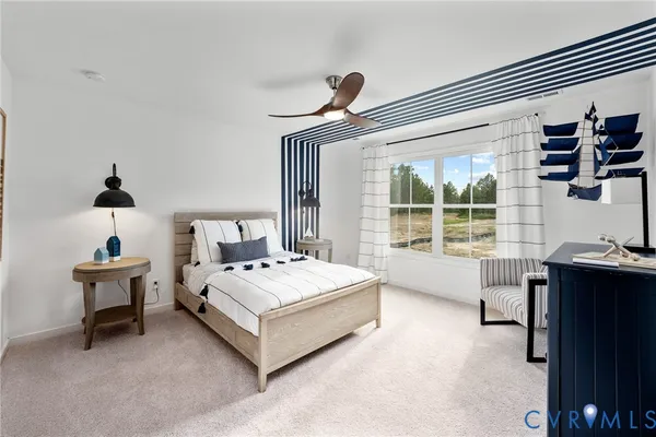 a spacious bedroom with a bed and a desk