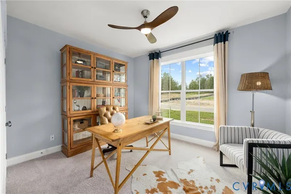 a workspace with furniture and a window