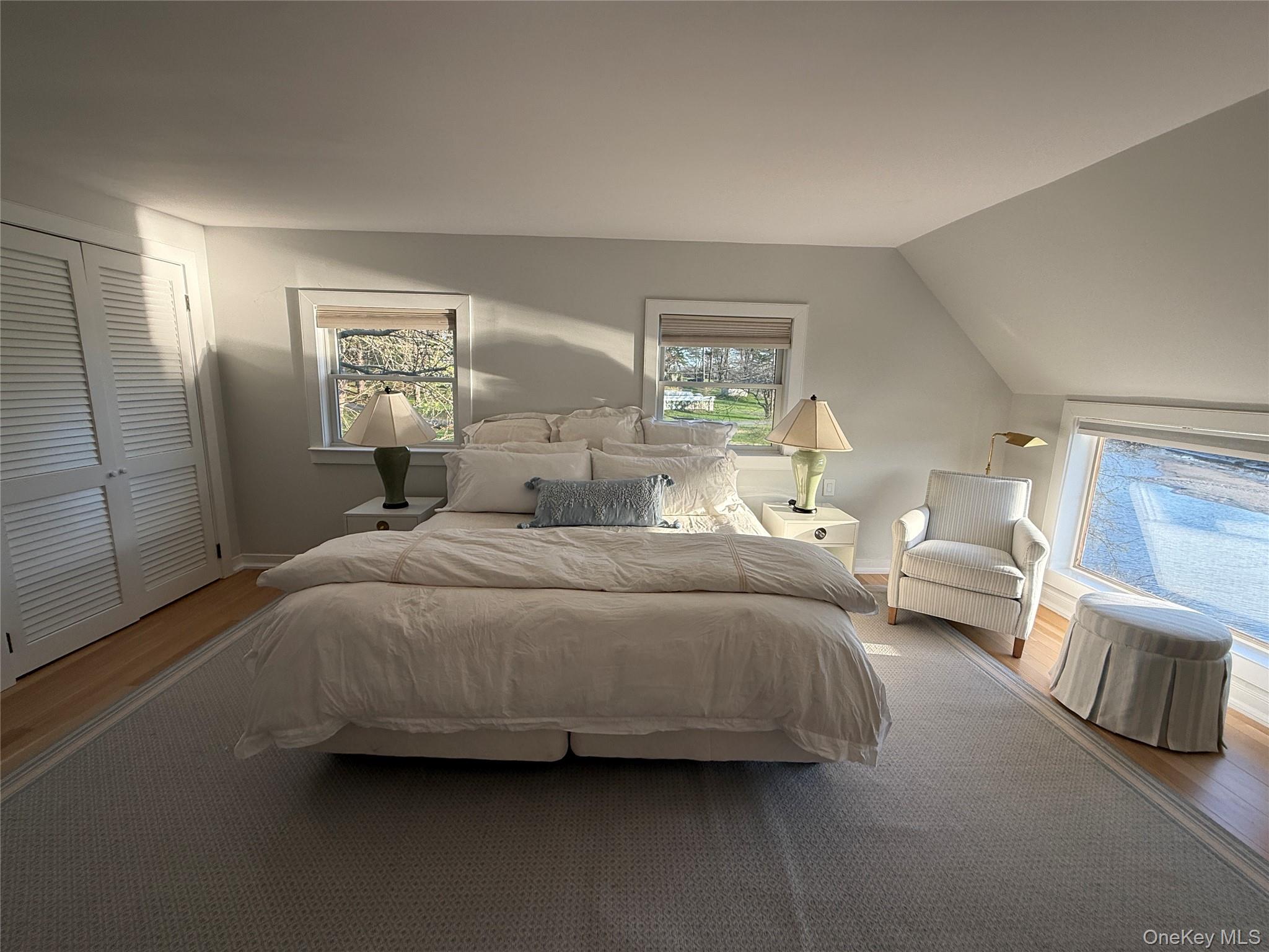 329 Centre Island Road Centre Island, NY 11771 - Photo 17 of 28 a bedroom with a bed and a couch