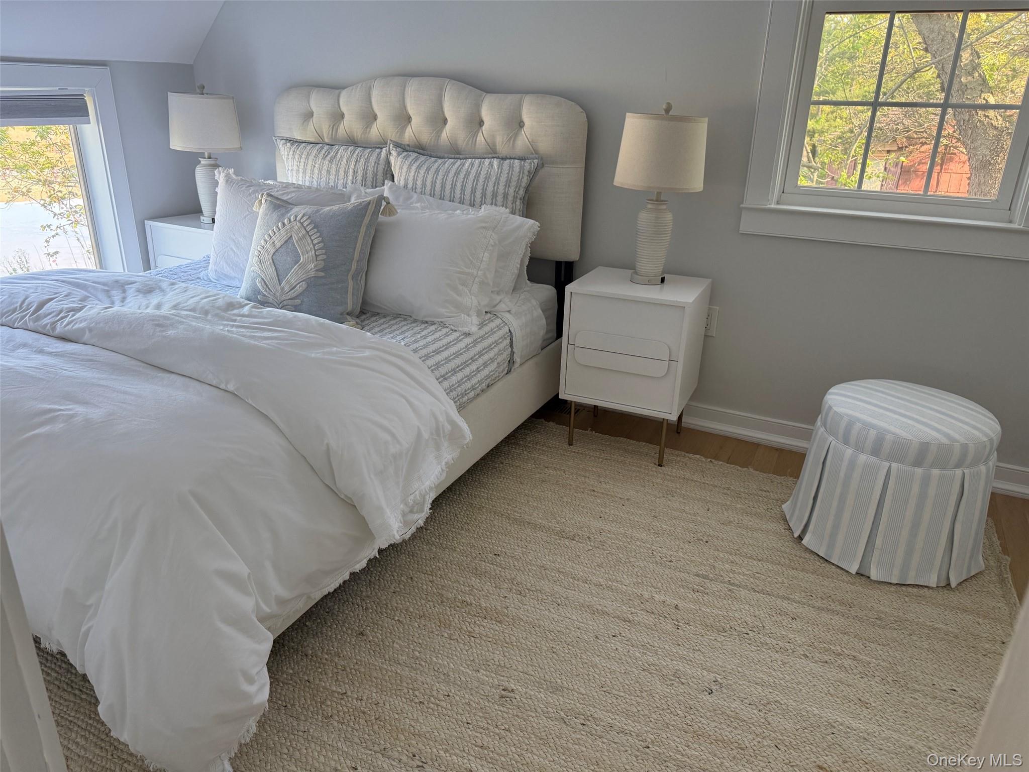329 Centre Island Road Centre Island, NY 11771 - Photo 20 of 28 a bedroom with a bed and a couch