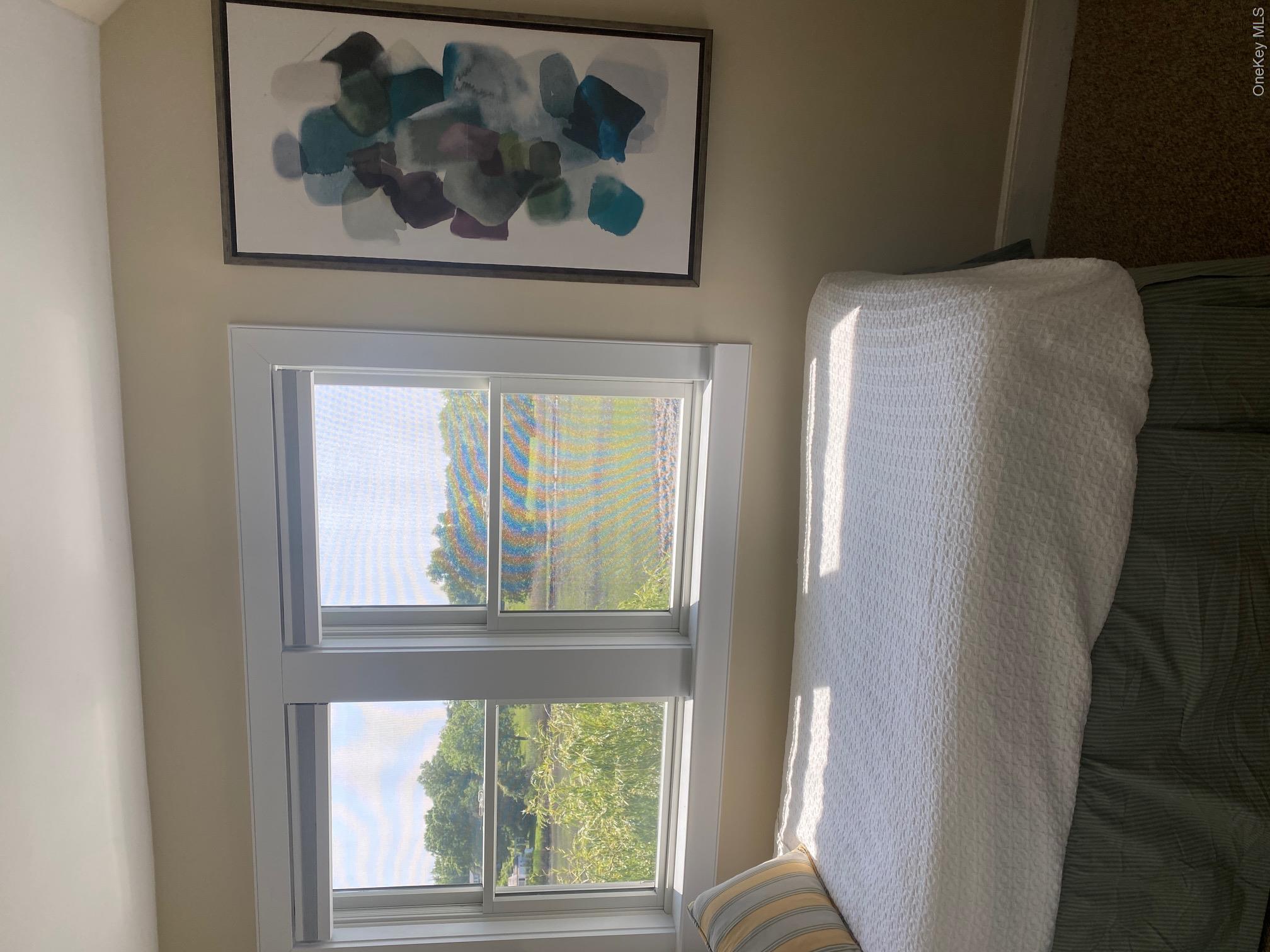 329 Centre Island Road Centre Island, NY 11771 - Photo 22 of 28 a bedroom with a bed and a window