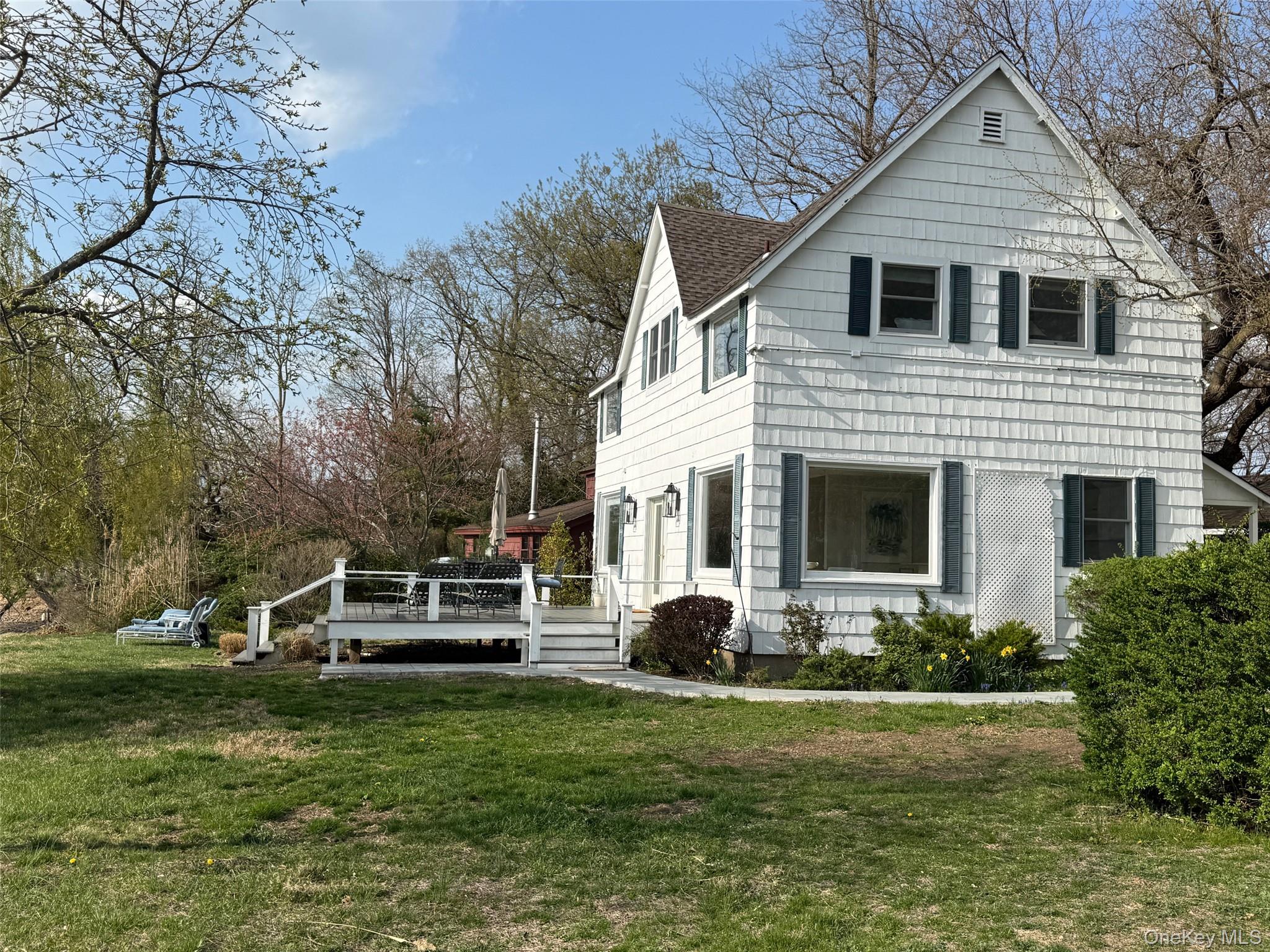 329 Centre Island Road Centre Island, NY 11771 - Photo 27 of 28 a front view of a house with a yard