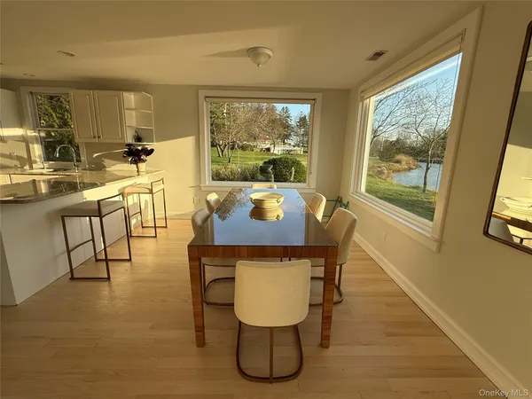 a view of a dining room with furniture window and outside view