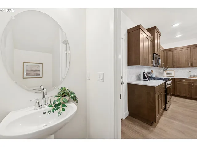 a bathroom with a sink vanity and a mirror